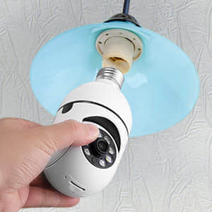 A man attaching SafeCam 360 to a light