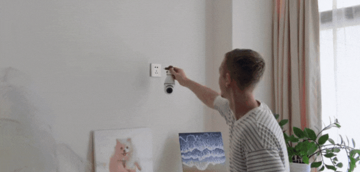 A man using SafeCam 360 in his room to keep it safe